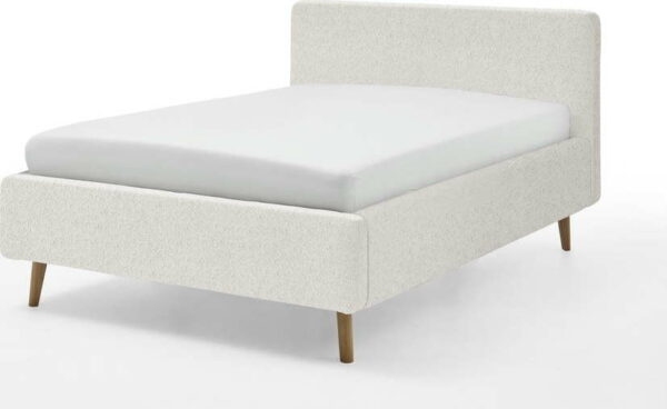 Bílá čalouněná dvoulůžková postel s úložným prostorem s roštem
